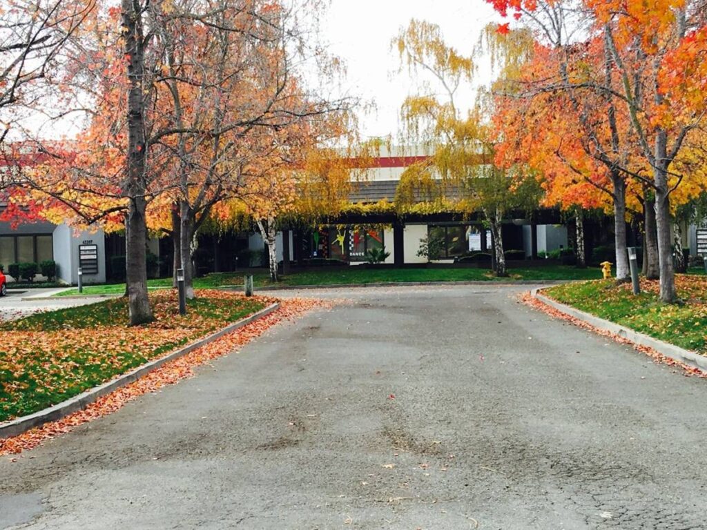 Tree-lined entrance to the business park on Osgood Road in Fremont where the Fasthuma iT office is